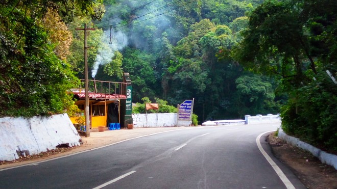 Bends and Slopes - A view of a roadside tea-shop near a bend on the mountain