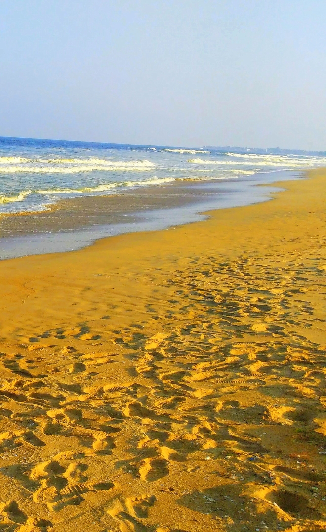 Pedestrian Sands - A picture of footprints along the seashore